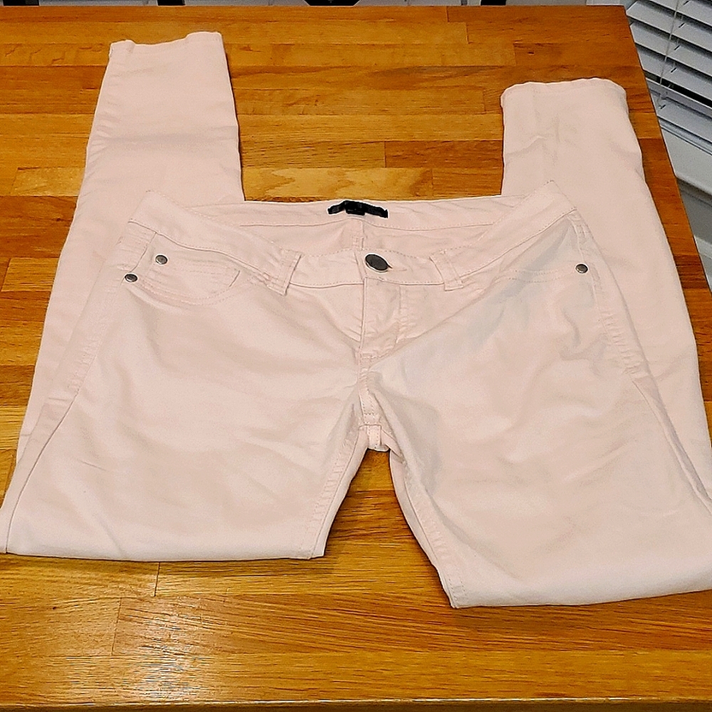 Pale pink skinny jeans